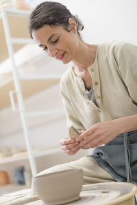 Side view of man working at table