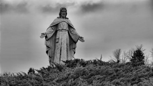 Low angle view of statue against sky