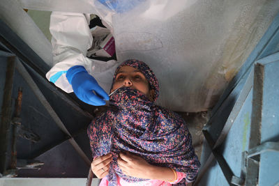 High angle view of girl sleeping on floor