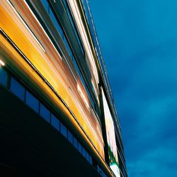 Low angle view of illuminated building against sky at night