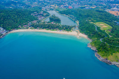 Aerial view of beautiful tropical beach and sea with palm and ot