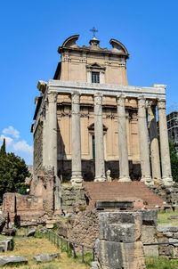 Low angle view of old building against blue sky