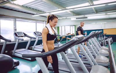 People walking on treadmills in gym