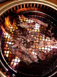 Close-up of meat on barbecue grill