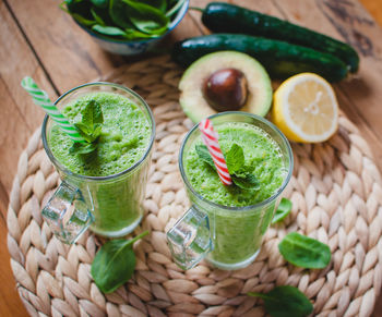 Close-up of green smoothie in a glass with fresh mint