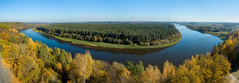 Panoramic shot of trees on landscape against sky