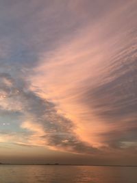 Scenic view of sea against orange sky