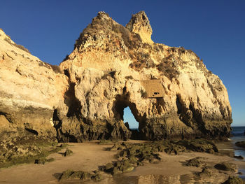 Scenic view of rock formation against clear sky