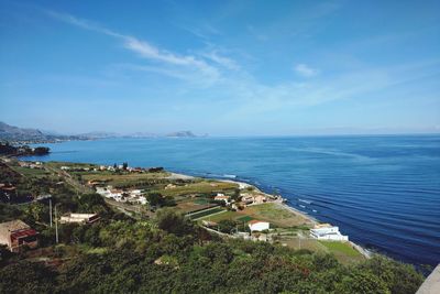 Scenic view of sea against blue sky