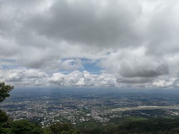 Aerial view of cityscape against sky