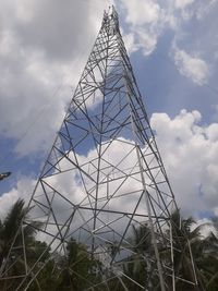 Low angle view of communications tower against sky