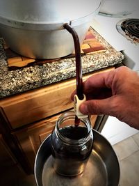 High angle view of man preparing food in kitchen