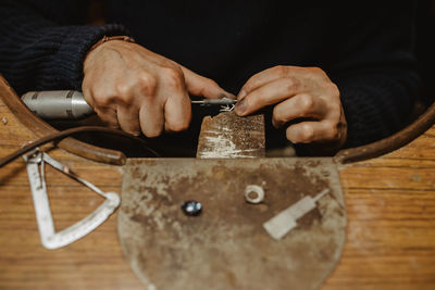 Close-up of man working on table
