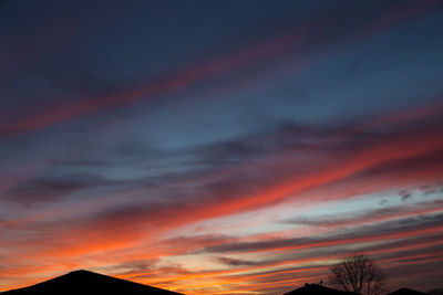 Low angle view of dramatic sky during sunset