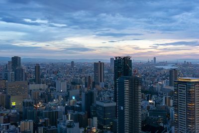 High angle view of modern buildings in city against sky