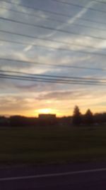 Silhouette landscape against sky during sunset