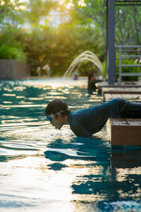 Boy playing in swimming pool