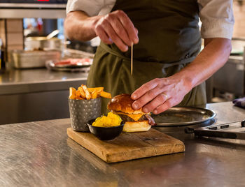 Man preparing food in kitchen at home