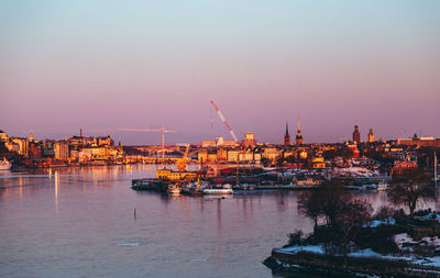 View of harbor against sky during sunset