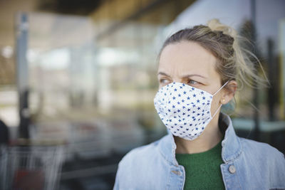 Woman wearing mask looking away