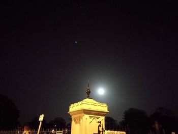 Illuminated city against sky at night