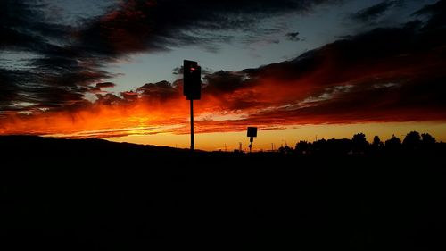 Silhouette of landscape against dramatic sky