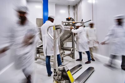 People working in kitchen