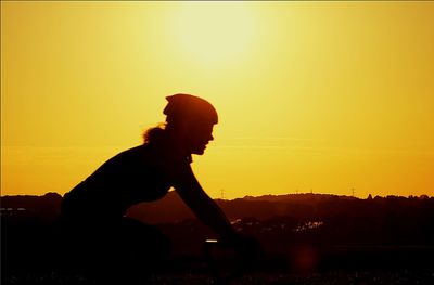 Silhouette of people at sunset