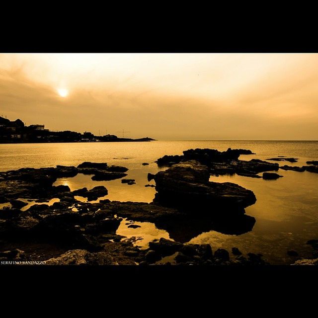 sunset, water, sea, sky, tranquil scene, tranquility, scenics, beauty in nature, beach, nature, rock - object, reflection, shore, horizon over water, orange color, idyllic, silhouette, dusk, auto post production filter, transfer print