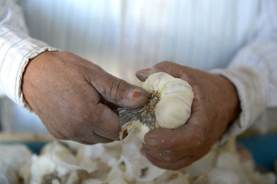 Close-up of man hand holding water