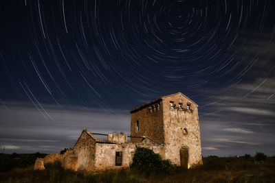 Low angle view of building against sky at night