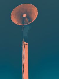 Low angle view of balloons against blue sky