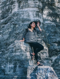 Woman standing on rock