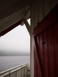 Close-up of built structure by sea against sky