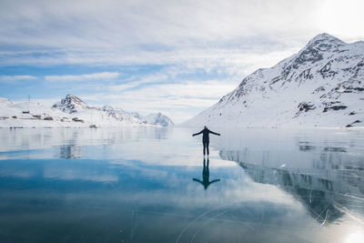 Scenic view of snowcapped mountain against cloudy sky