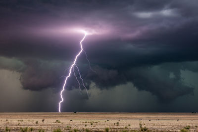 A bright lightning bolt strikes from a severe thunderstorm in new mexico.