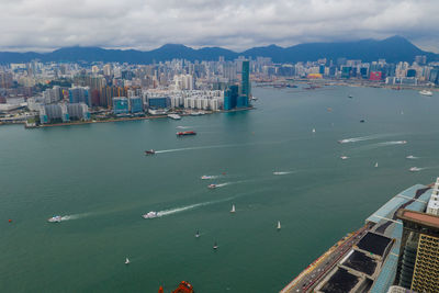 High angle view of harbor and buildings in city