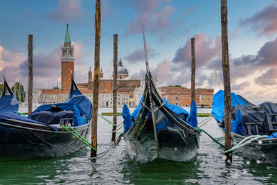 Gondolas moored by saint mark square in venice