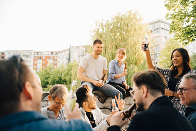 Male and female friends enjoying at social gathering