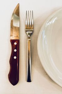 High angle view of fork on table