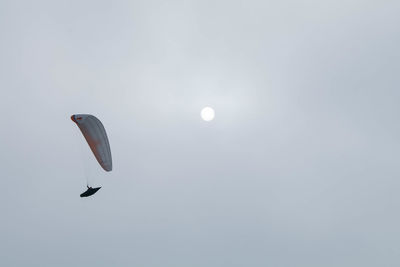 Low angle view of kite flying against sky