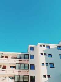 Low angle view of building against clear blue sky