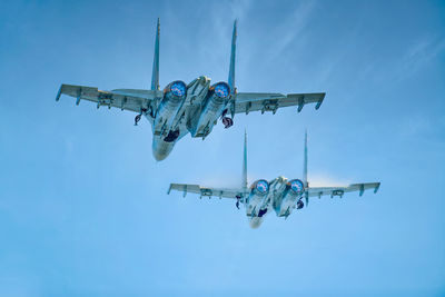 Low angle view of airplane against sky