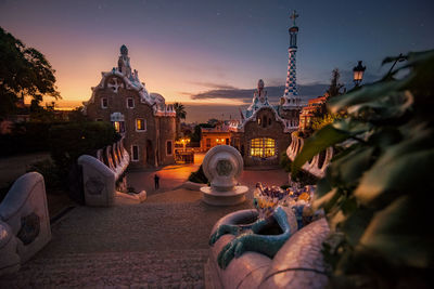 Panoramic view of buildings against sky at sunset