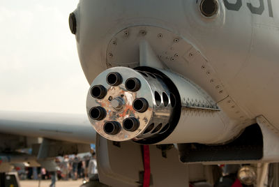 Close-up of airplane at airport runway