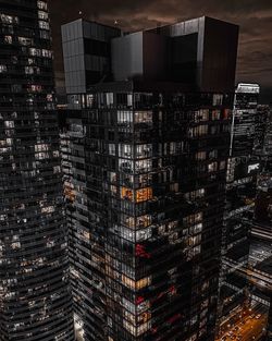 High angle view of illuminated buildings in city at night