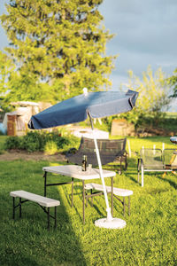 Chairs and table in field