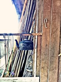 Low angle view of rope hanging on wall