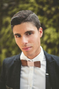 Portrait of young man standing outdoors