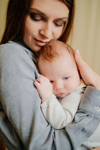 Portrait of mother with baby